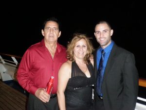 Florida National University graduate Yusnier Gutierrez with his parents