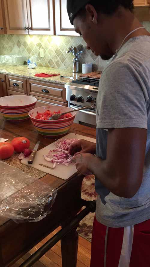 Player cutting onion up for BBQ