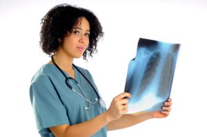 Female Radiologist Reviewing A Chest X-Ray