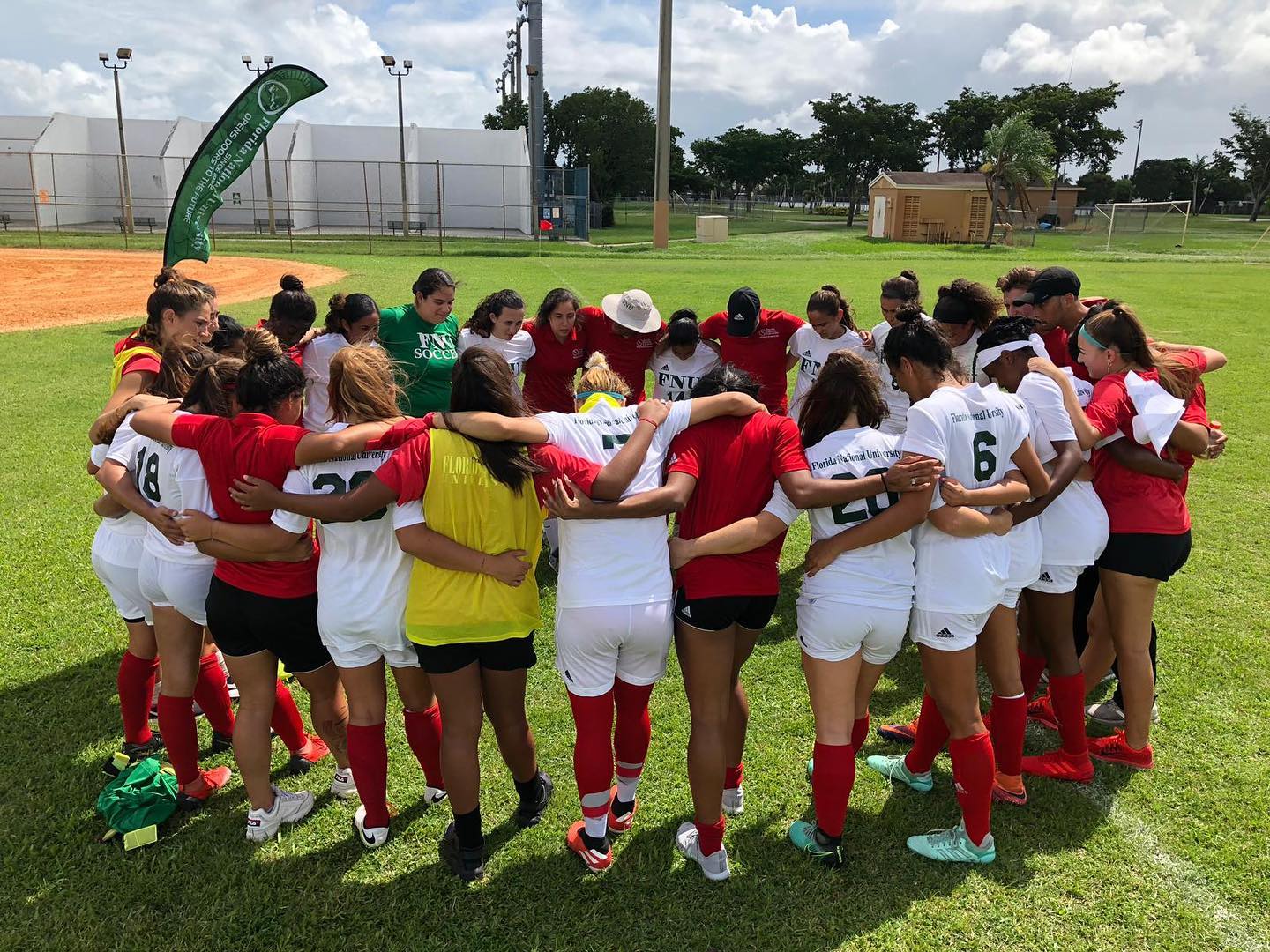FNU Women's soccer team huddling up in a circle