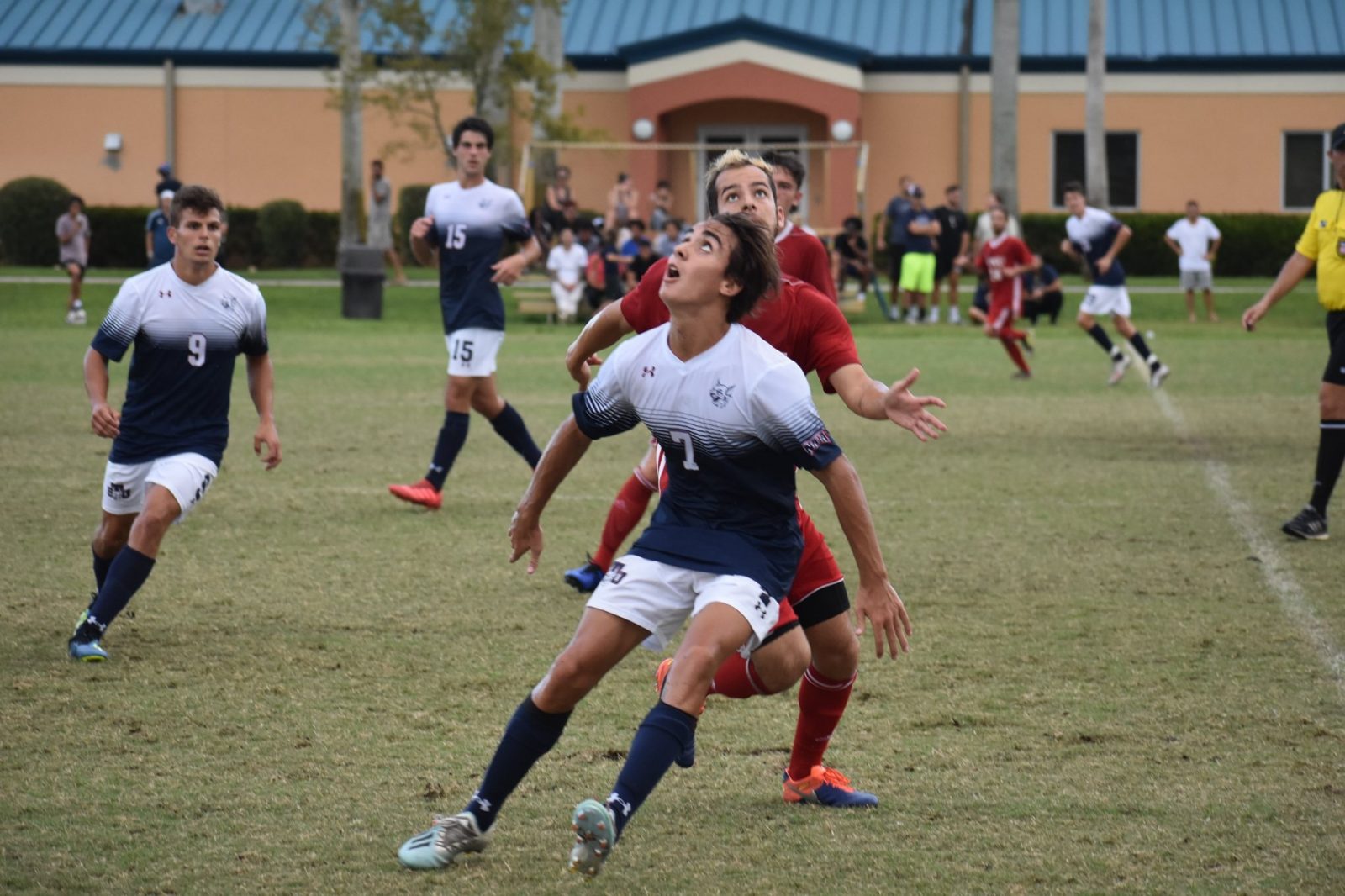 Florida National University player fighting for the ball during the soccer game