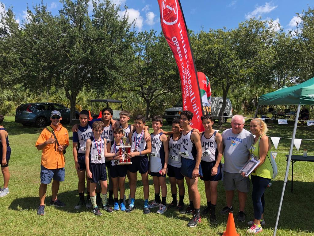 Team Receiving a trophy on the Cross Country meet