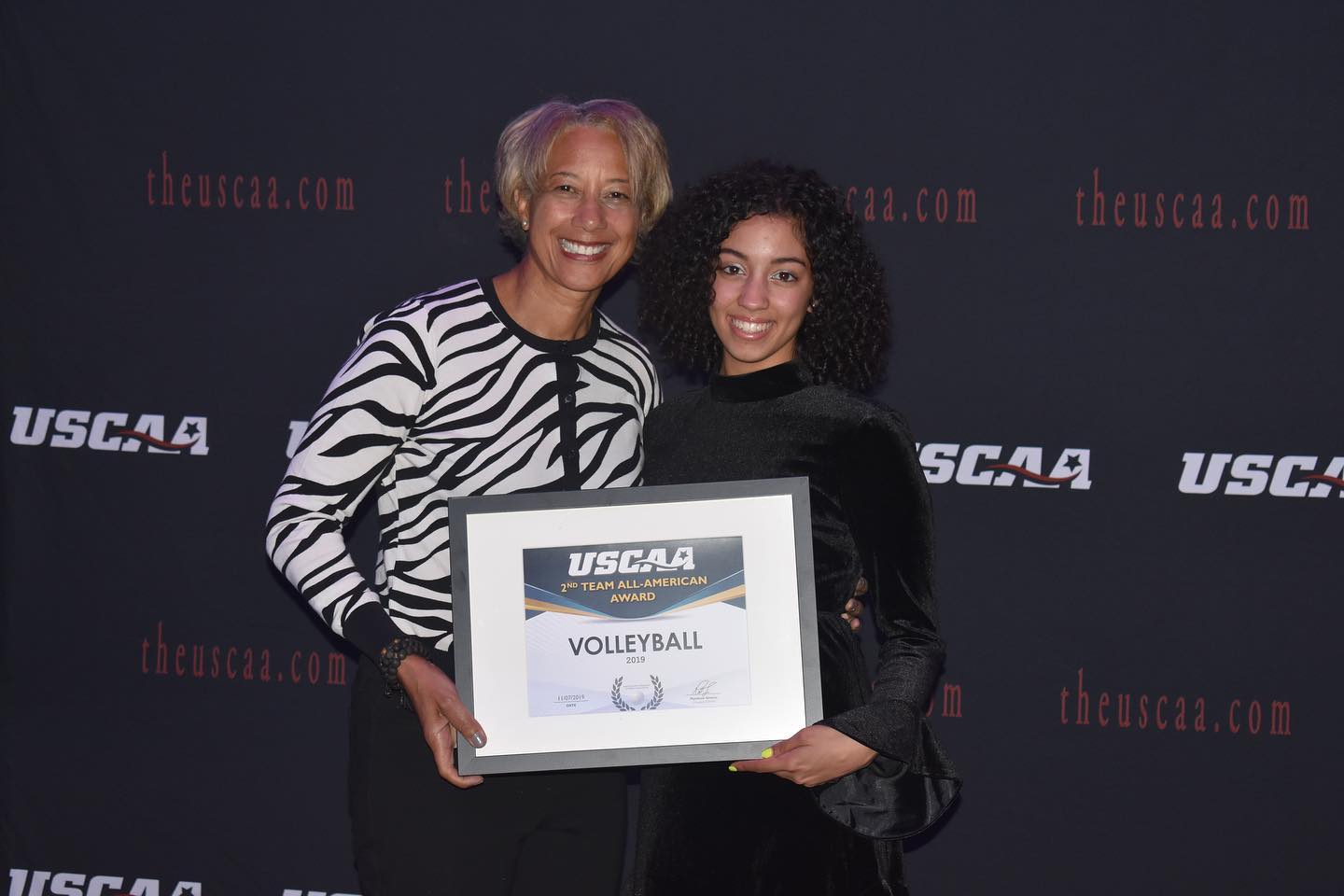 Women's Volleyball player Andrea Romero receiving All american second team Award