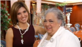 woman poses with older woman smiling