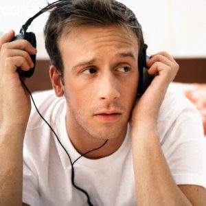 Man Listening to Music on Headphones