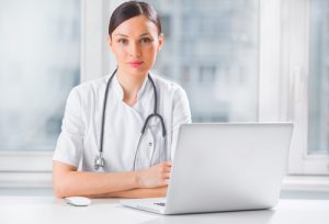 Female doctor in front of laptop 