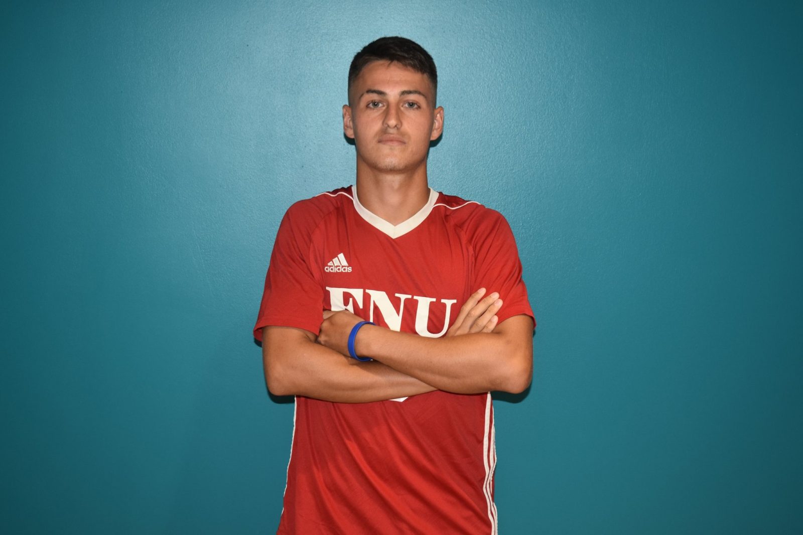 FNU soccer player with arms crossed