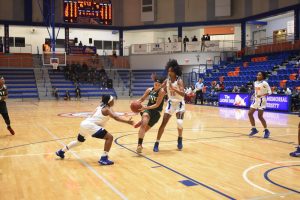 FNU women's basketball player Shannon Rosensteel dribbling the ball during the game against FMU