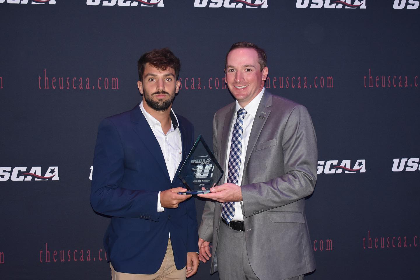 Men's Soccer player Manuel Villegas receiving All-American 1st team Award