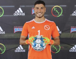 FNU goalkeeper Juan Manuel Fermoselle holding a soccer ball.