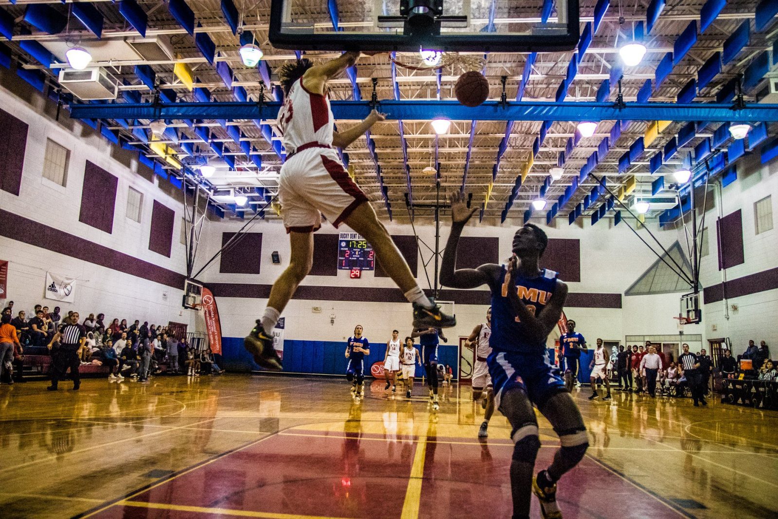 FNU basketball player Jeffrey dunking in the game