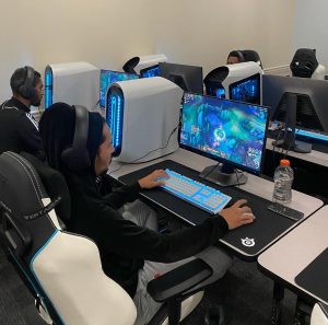 FNU eSports athlete at computer, playing League of Legends.