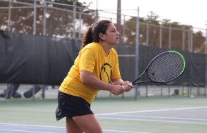 Tennis player Chiara Fiorenza holding racket, preparing for a swing.